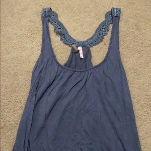 Women’s blouse gray, with lace details on straps.